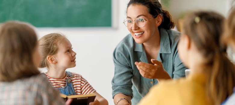 Happy kids and teacher at school